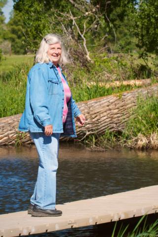 Marveen Carefully Crosses a Floating Bridge over a Creek at Carpenter Ranch