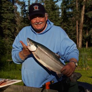 An Avid Outdoorsman and Fisherman, Wayne Shows Me a Sockeye Salmon He Just Caught